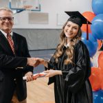 Graduation Ceremony - Photo of Happy Woman in Graduation Gown